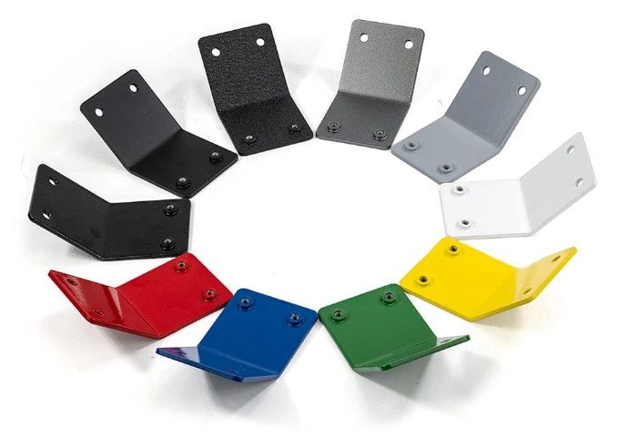 Powder coated sheet metal parts after curing, showing an even coloured finish