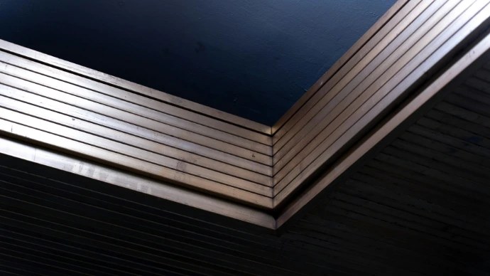 Stainless steel sheets showing the difference between mill and brushed surface finishes